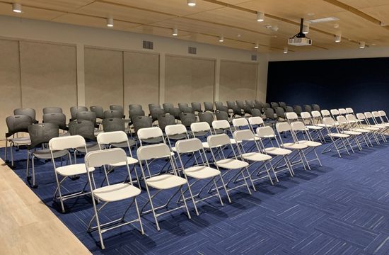 classroom set up with rows of chairs